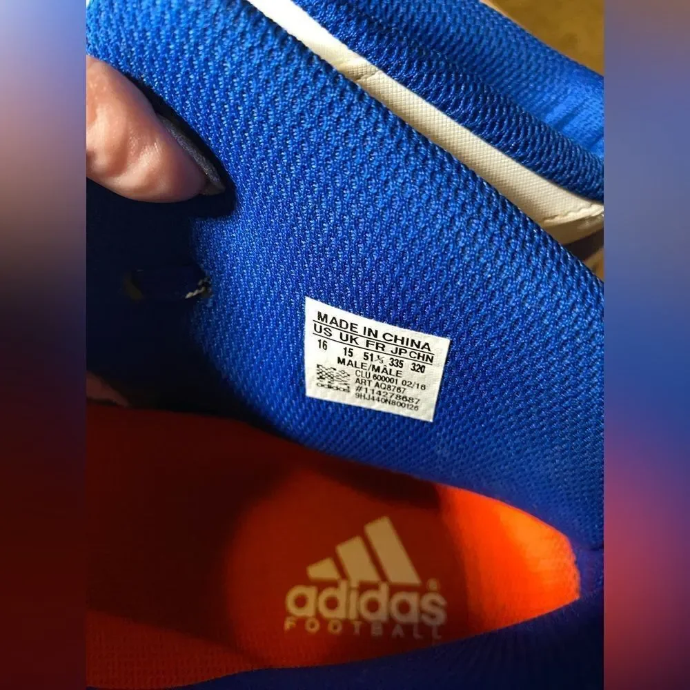 Adidas blue and white cleats‎